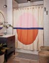 bathroom with pink and orange shower curtain