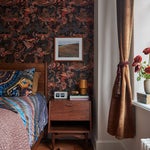 Bedroom with maximalist wallpaper