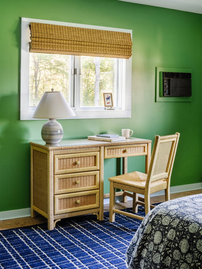 green bedroom with desk