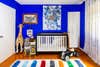 crib in blue bedroom