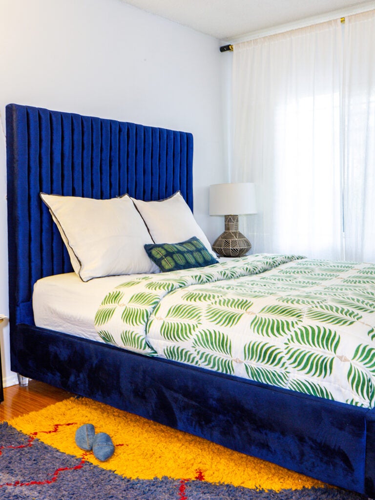 blue upholstered bed