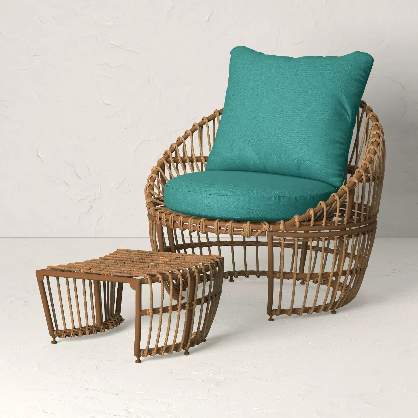 rattan club chair with blue cushion