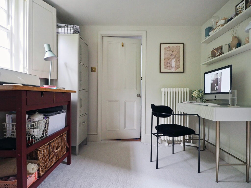 basement office with white desk