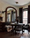 Black Banquette and Kitchen with Antique Arched Mirror