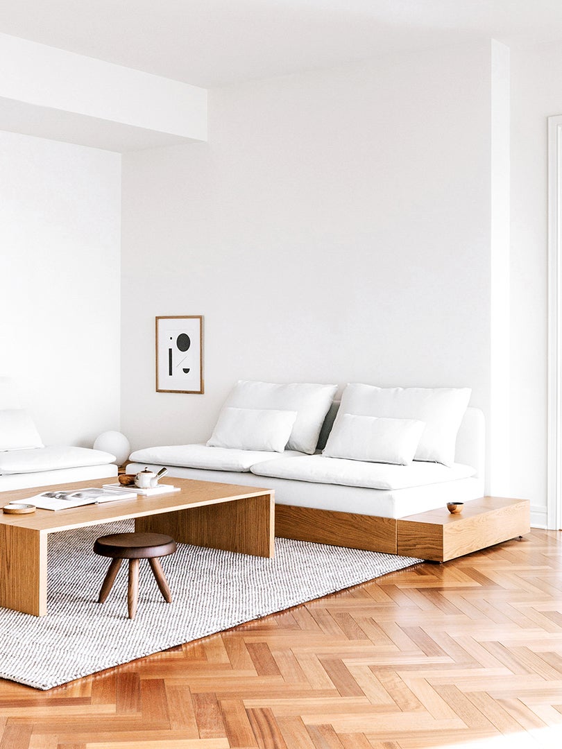 living room with white platform sofa