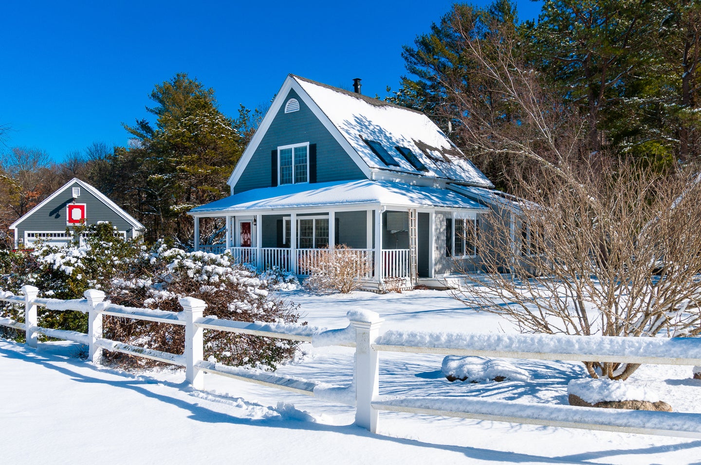 snowy exterior of blue home