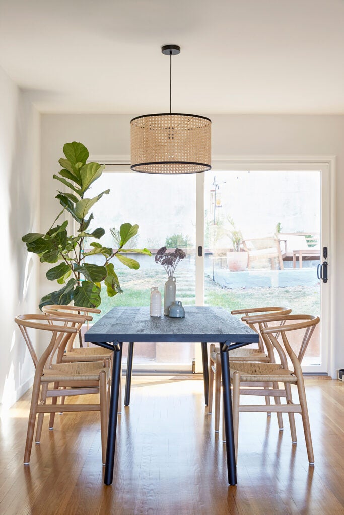 woven cane light over dining table