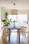 woven cane light over dining table