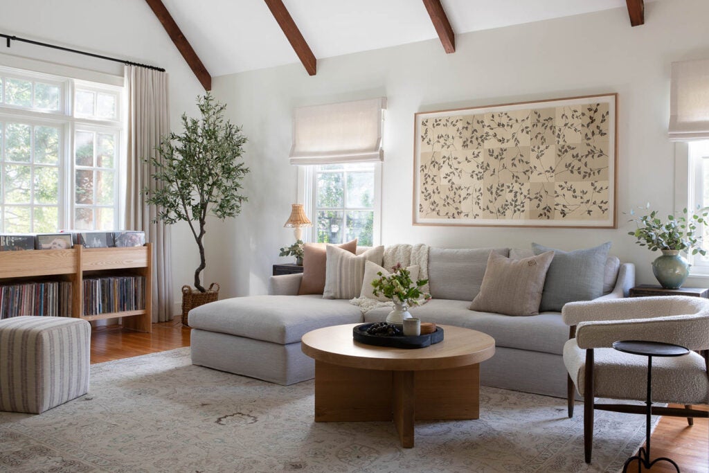 living room with white sofa and wood coffee table