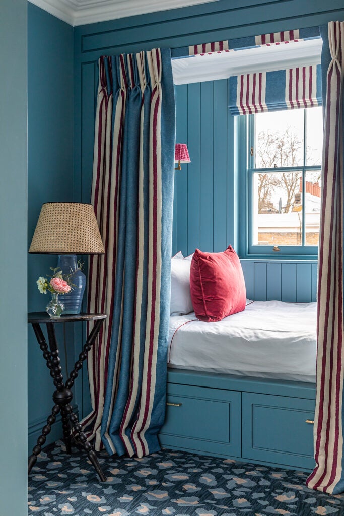 alcove bed with striped curtains