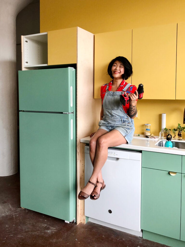 woman sitting on counter