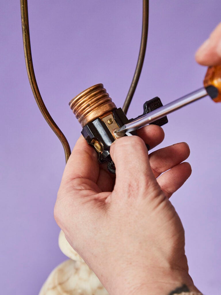 tightening screws on lamp socket shell