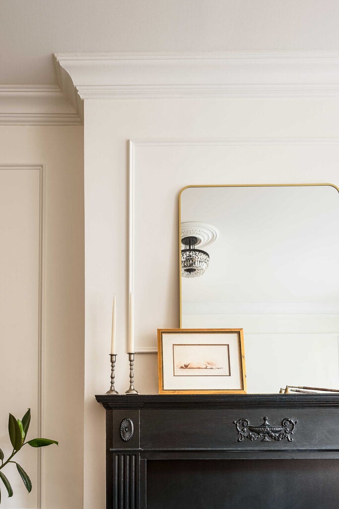 mirror leaning on fireplace