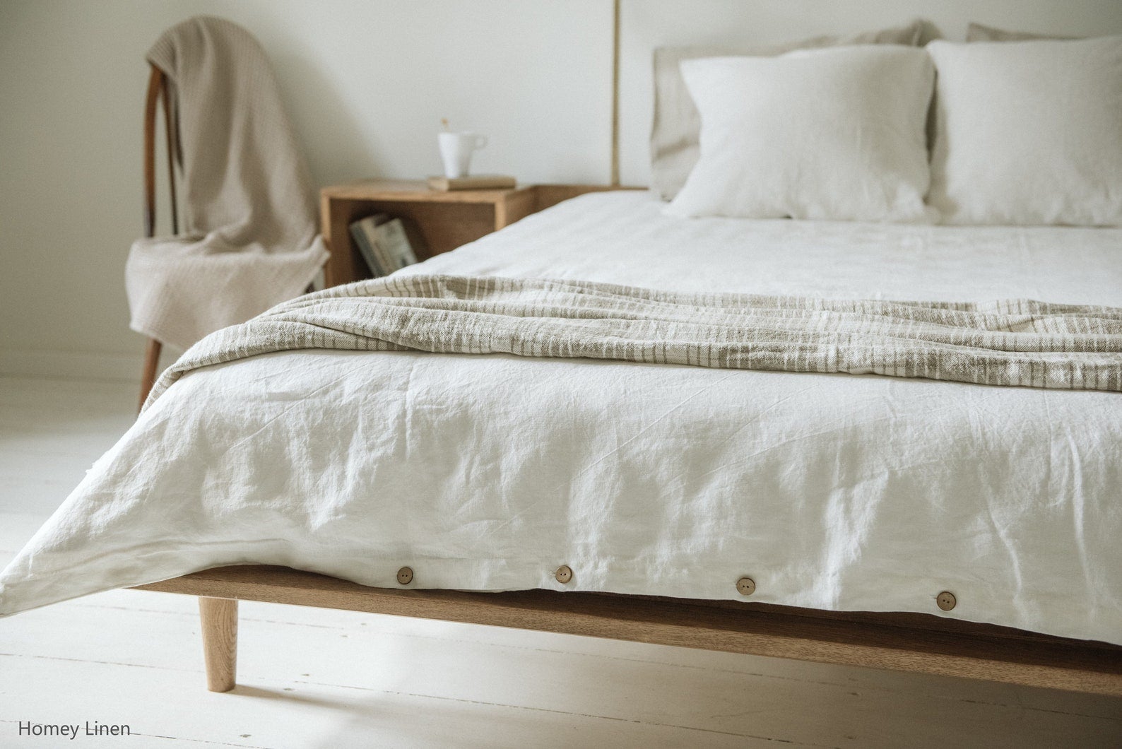 bed with white linen sheets