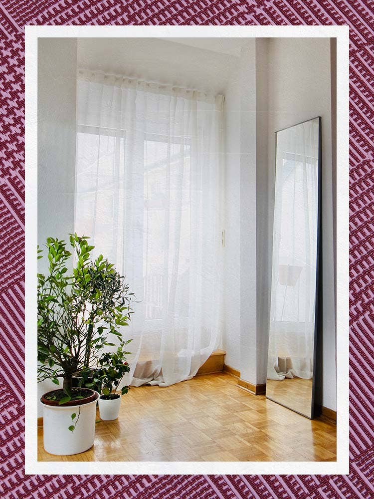 White Sheer Curtains over tall windows