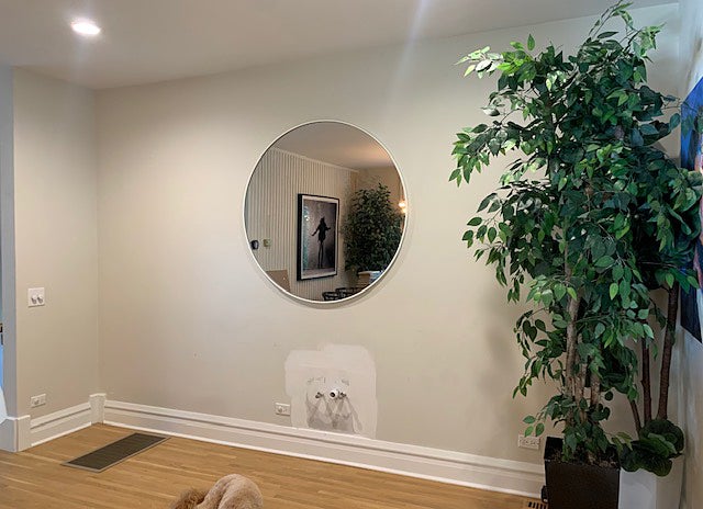 round mirror on wall