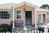 pink home exterior with white trim