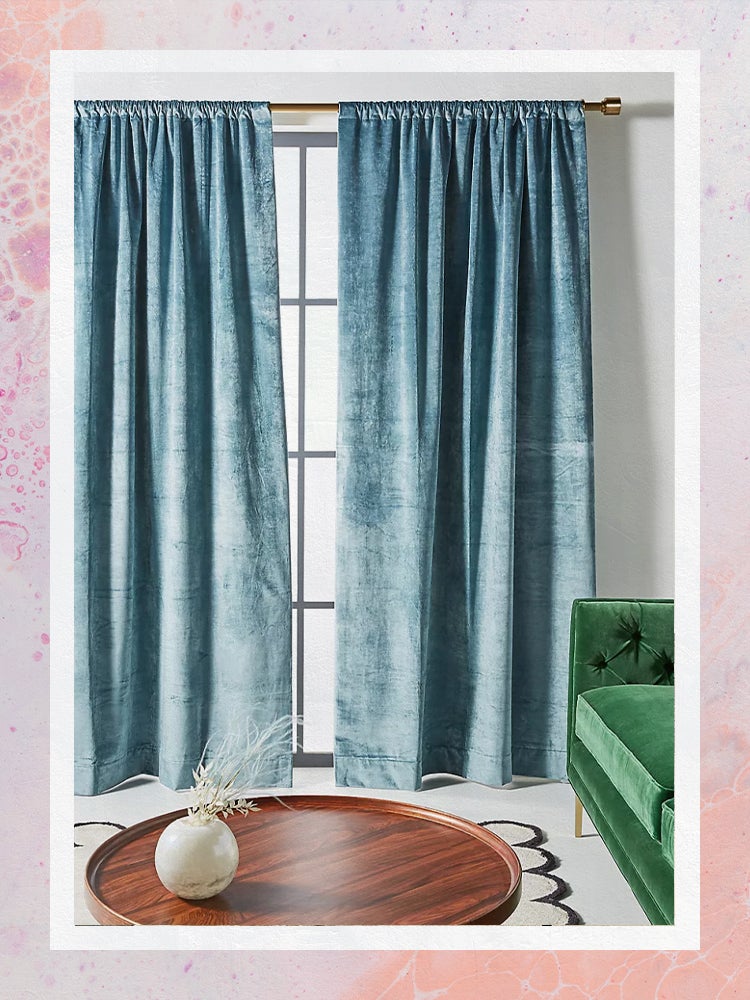 Matte Blue Velvet Curtains behind Green Sofa and Wood Coffee Table