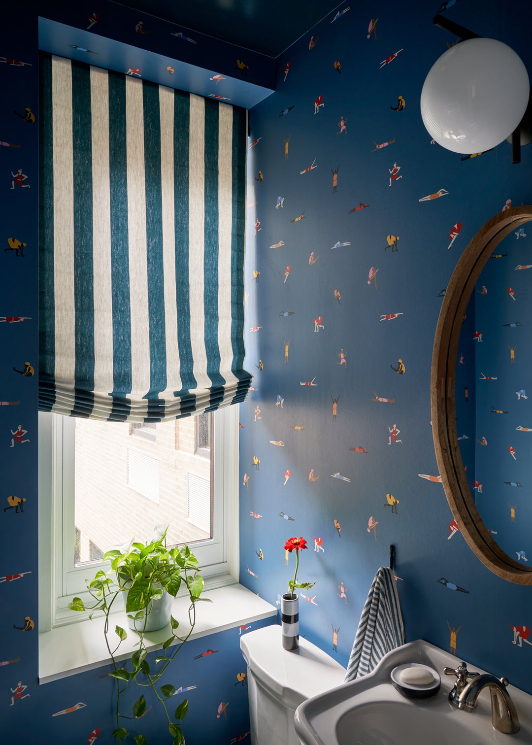 blue wallpapered powder room