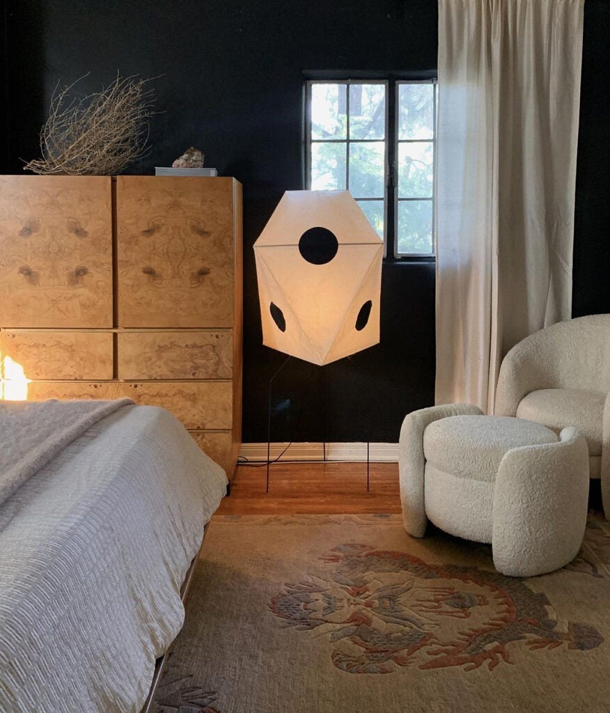 black painted bedroom with lantern