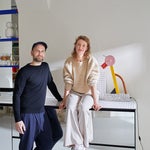 portrait of two people in a small kitchen