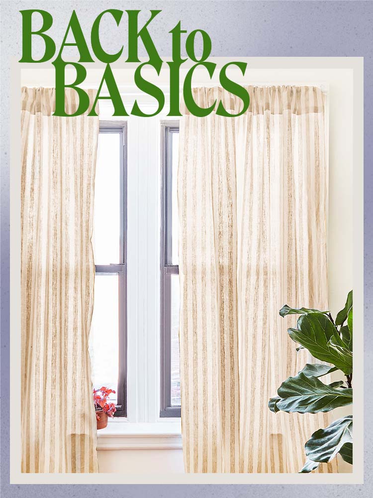 cream semi-sheer curtain panels with plant in foreground