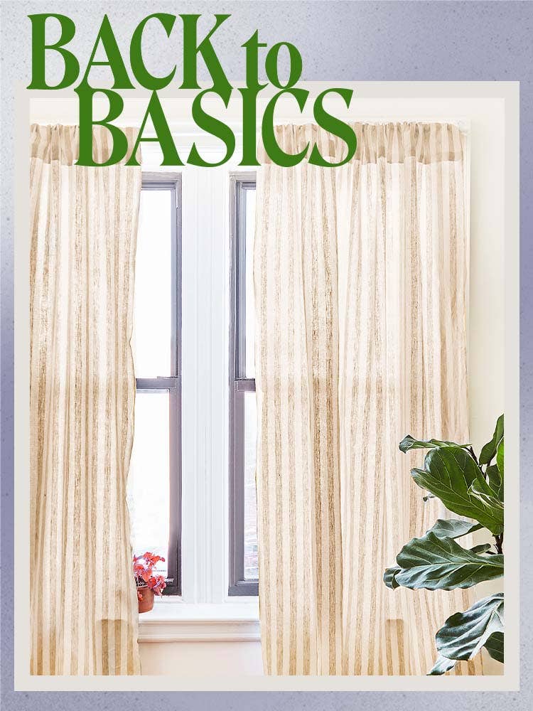 cream semi-sheer curtain panels with plant in foreground