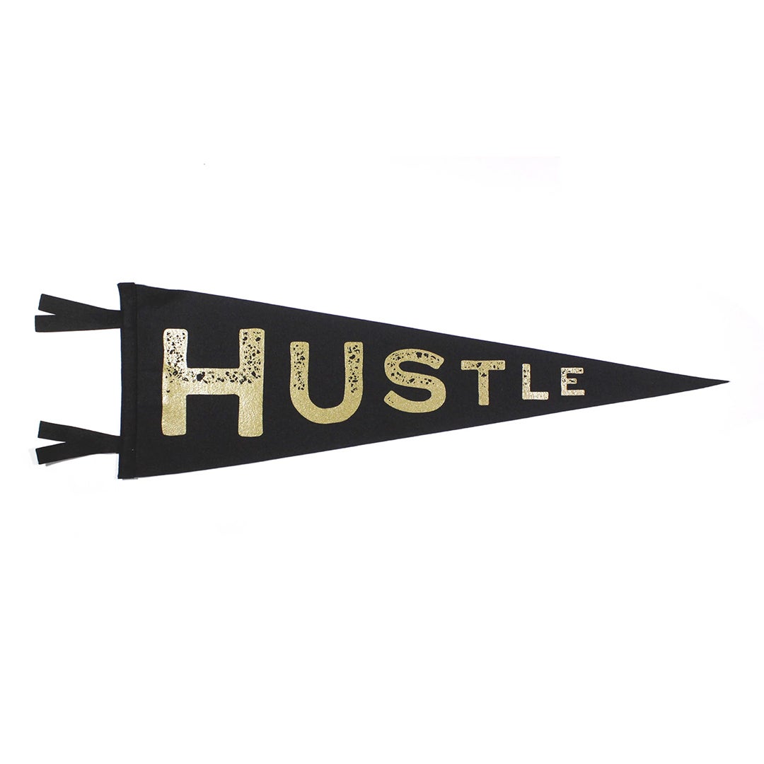 black pennant with "hustle" in gold