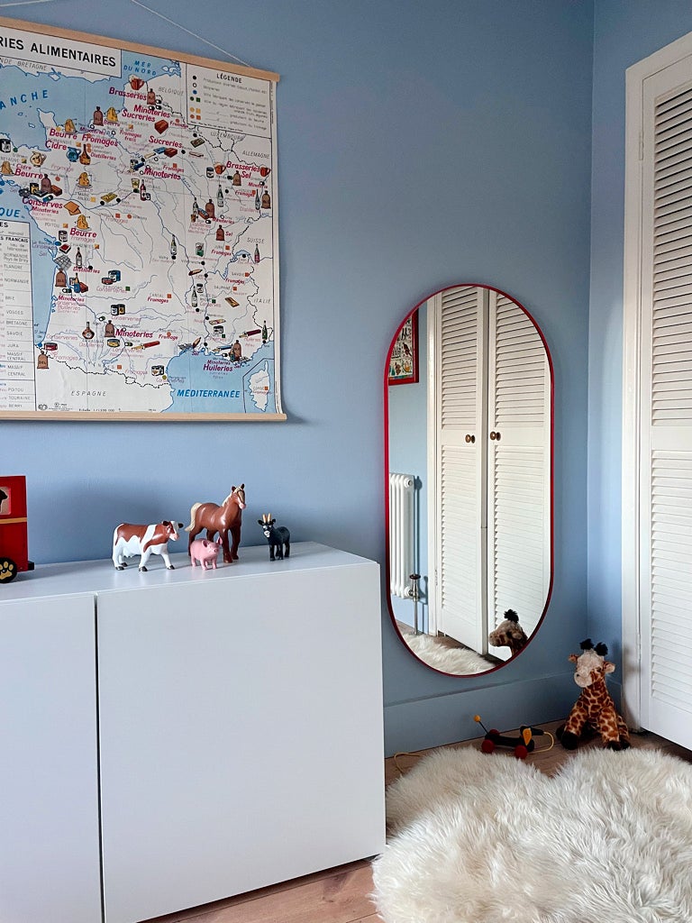 mirror next to white dresser