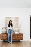 woman leaning on credenza
