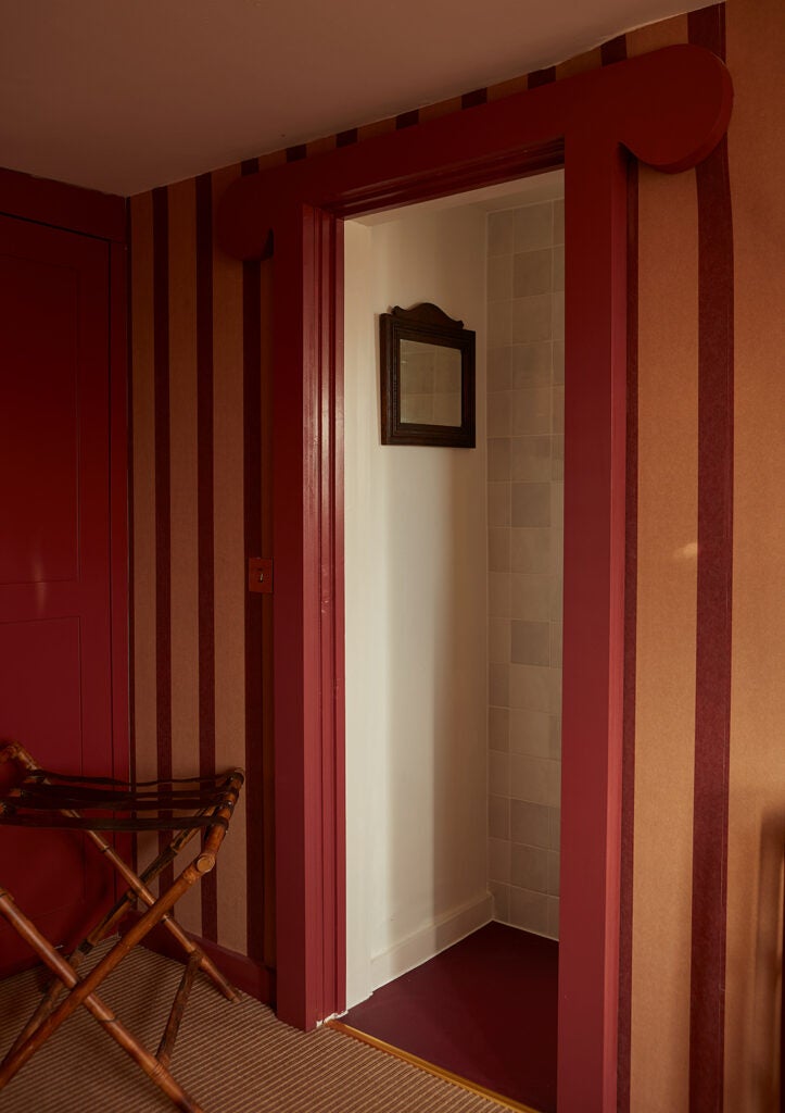 red threshold leading to bathroom
