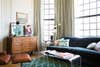 tan drapes deep turquoise sofa mid-century modern living room