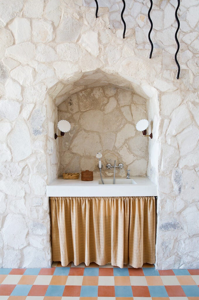 sink with curtain and tiled floors