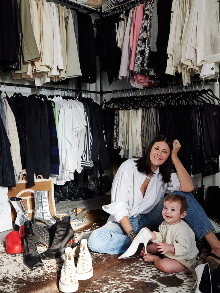 woman in closet with baby