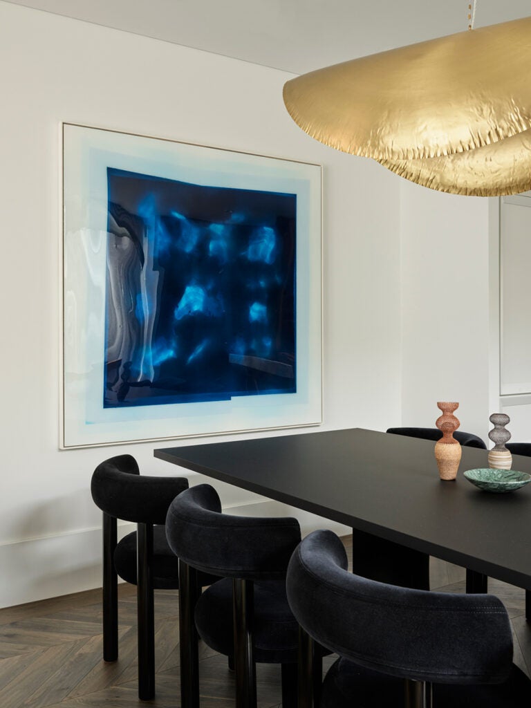 blue art in dining room
