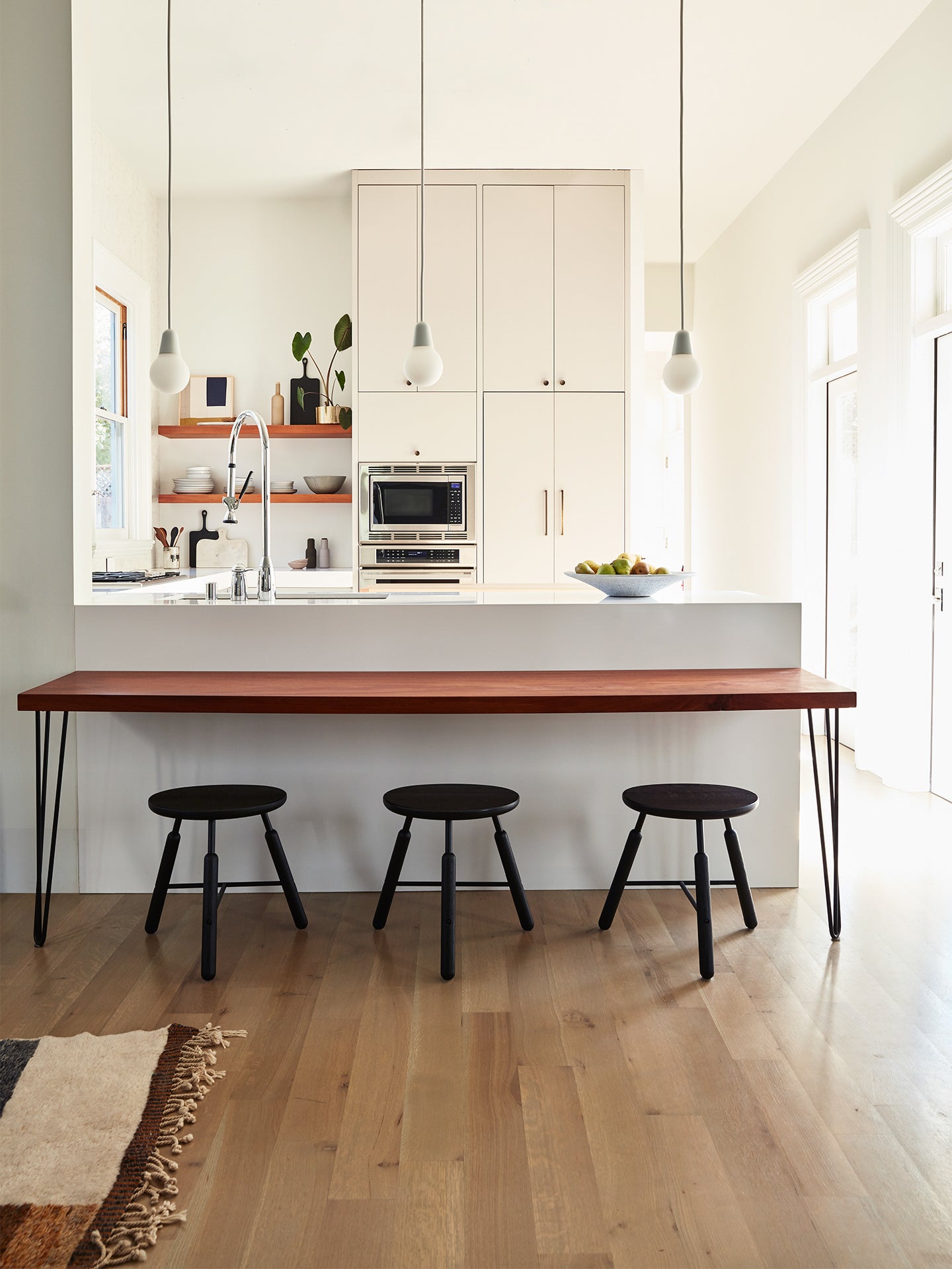 kitchen with black counter stools