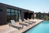 shipping container pool with loungers