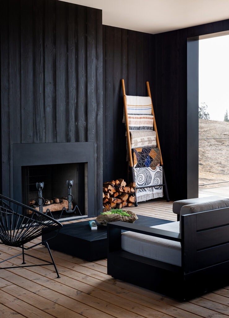 outdoor fireplace with ladder of blankets