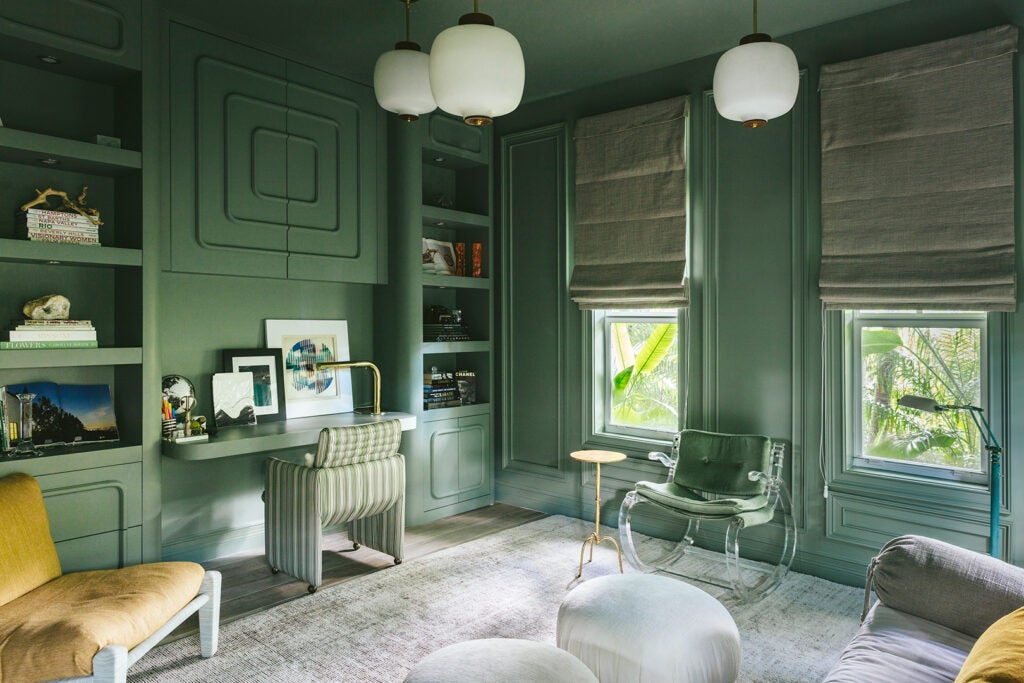 A Curvy Spin on Picture Frame Molding Takes the Formality Out of This Sage Green Office