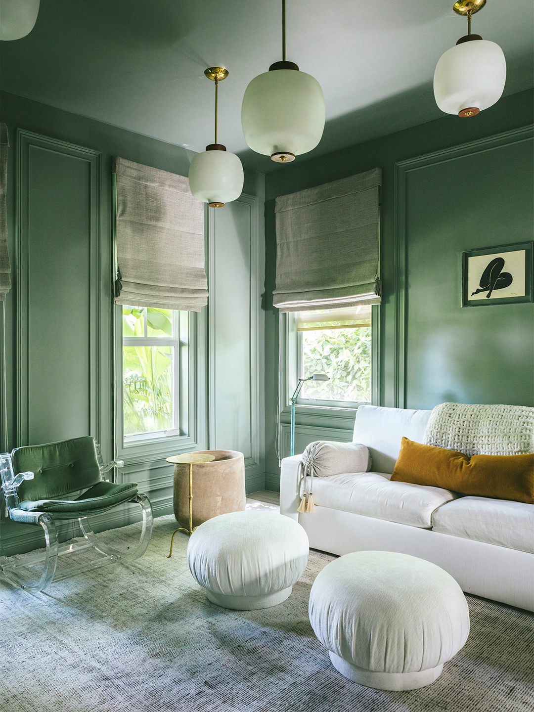 A Curvy Spin on Picture Frame Molding Takes the Formality Out of This Sage Green Office | domino