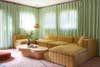 green curtains behind sofa