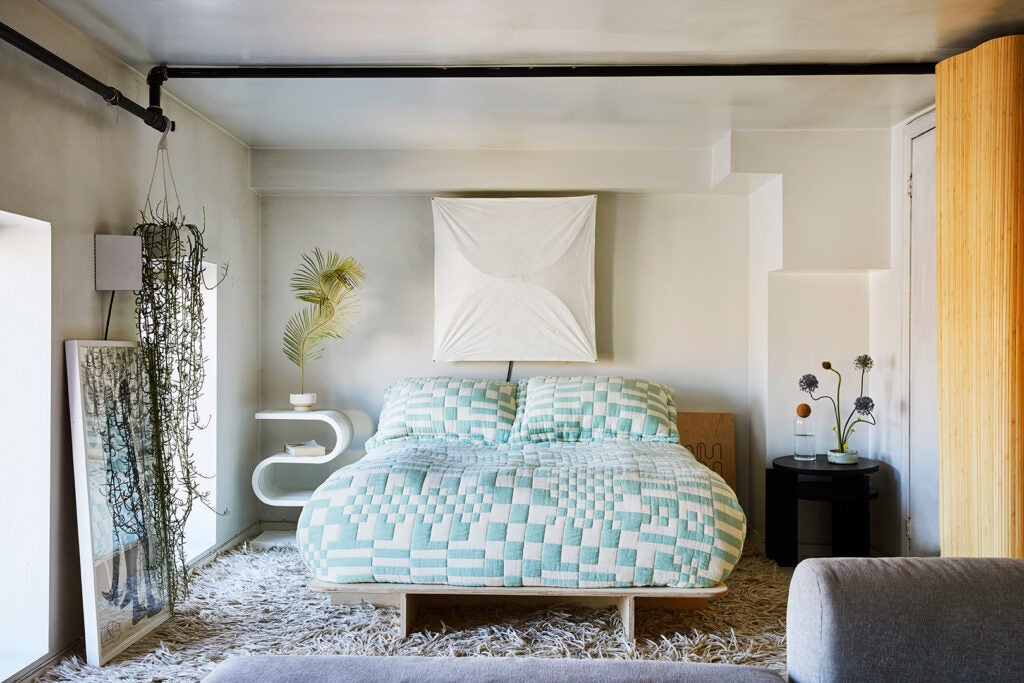 bedroom with mint green bedding