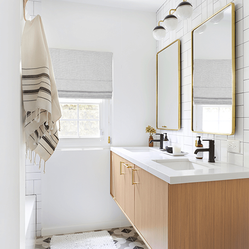 Everhem Roman Shades in Bathroom with Wood Vanity and Gold Mirros