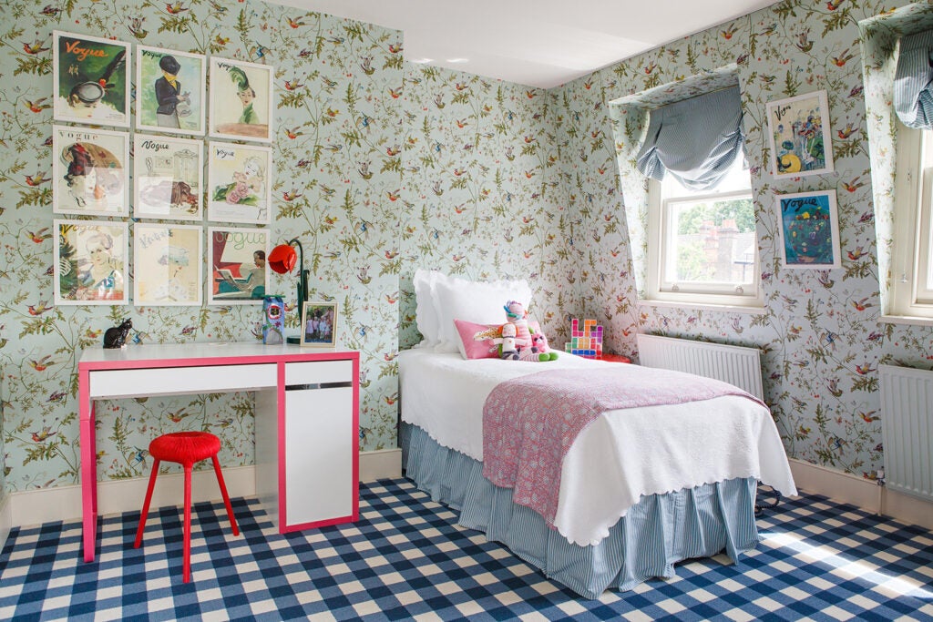 kid’s room with mint floral wallpaper and blue checkered carpet