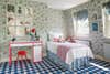 kidâs room with mint floral wallpaper and blue checkered carpet