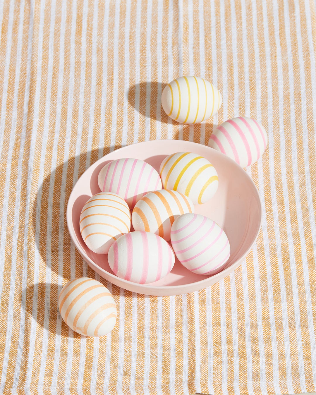 Striped Easter eggs in a bowl
