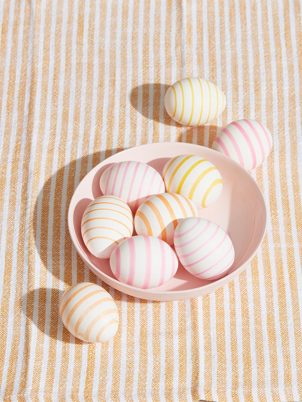 Striped Easter eggs in a bowl