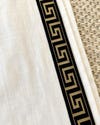 closeup of Greek key trim on white curtains