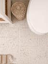 brown and white speckled bathroom tile