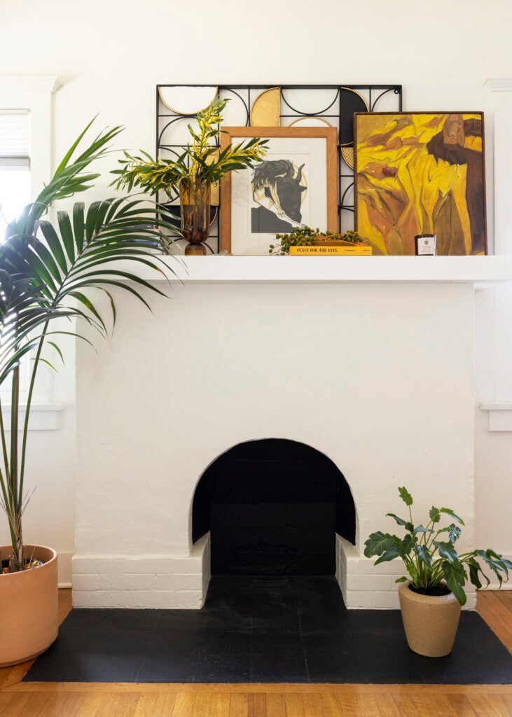 Fireplace with artwork on the mantle